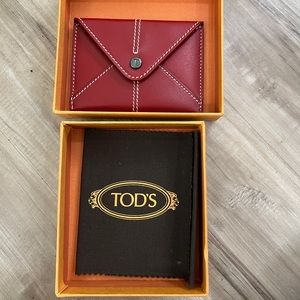 NWOT TOD’S red card holder with contrast stitching.